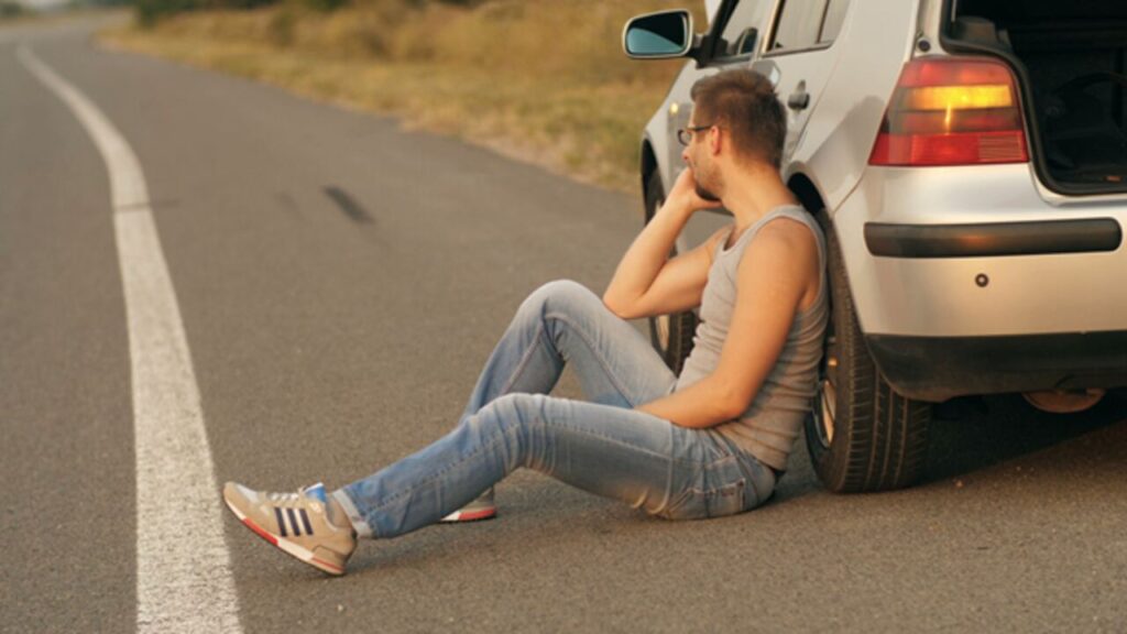 America’s Aging Vehicles and the Growing Towing Industry Tow truck operator loading an aging vehicle onto flatbed truck