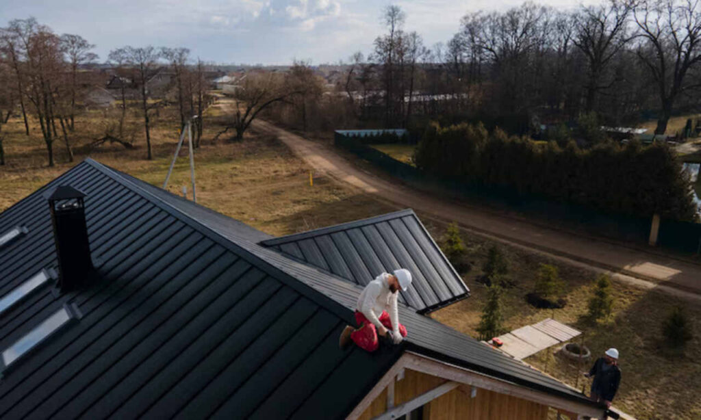 Worker installing durable roofing shingles with icons for protection and energy efficiency. 🏠🔧